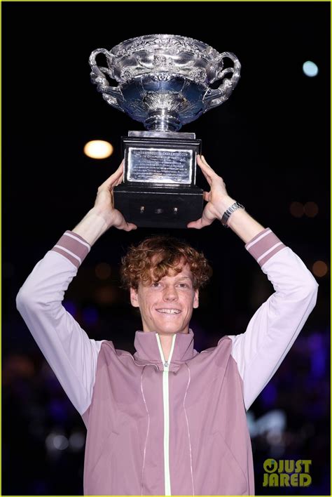 Jannik Sinner poses with his Australian Open trophy .